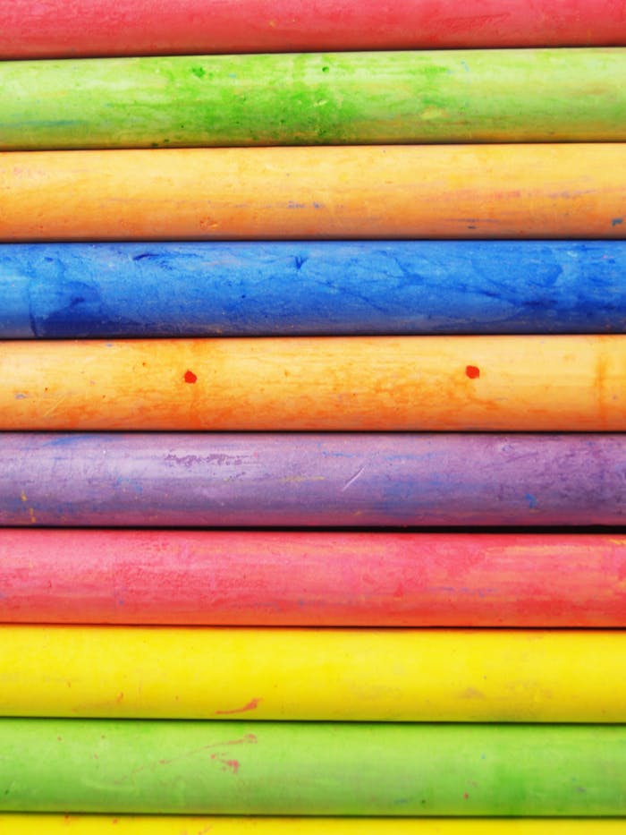 Brightly colored chalk sticks in a close-up, showcasing vibrant hues and artistic texture.
